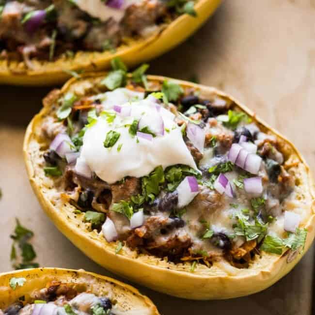 Stuffed spaghetti squash filled with chicken, beans, peppers, and onions.