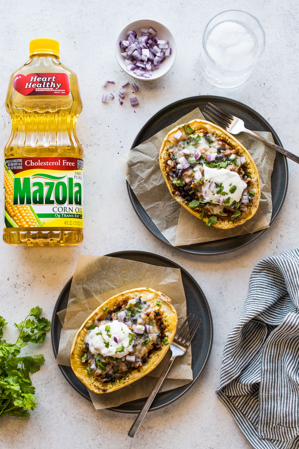 Spaghetti squash halves stuffed with taco-seasoned chicken, black beans, and peppers.