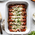 Cheese enchiladas in a baking dish.