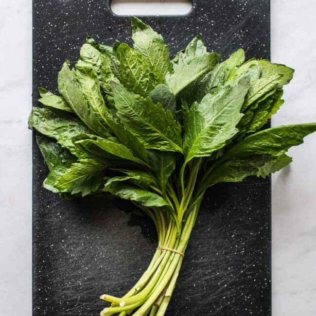 Fresh epazote on a cutting board.