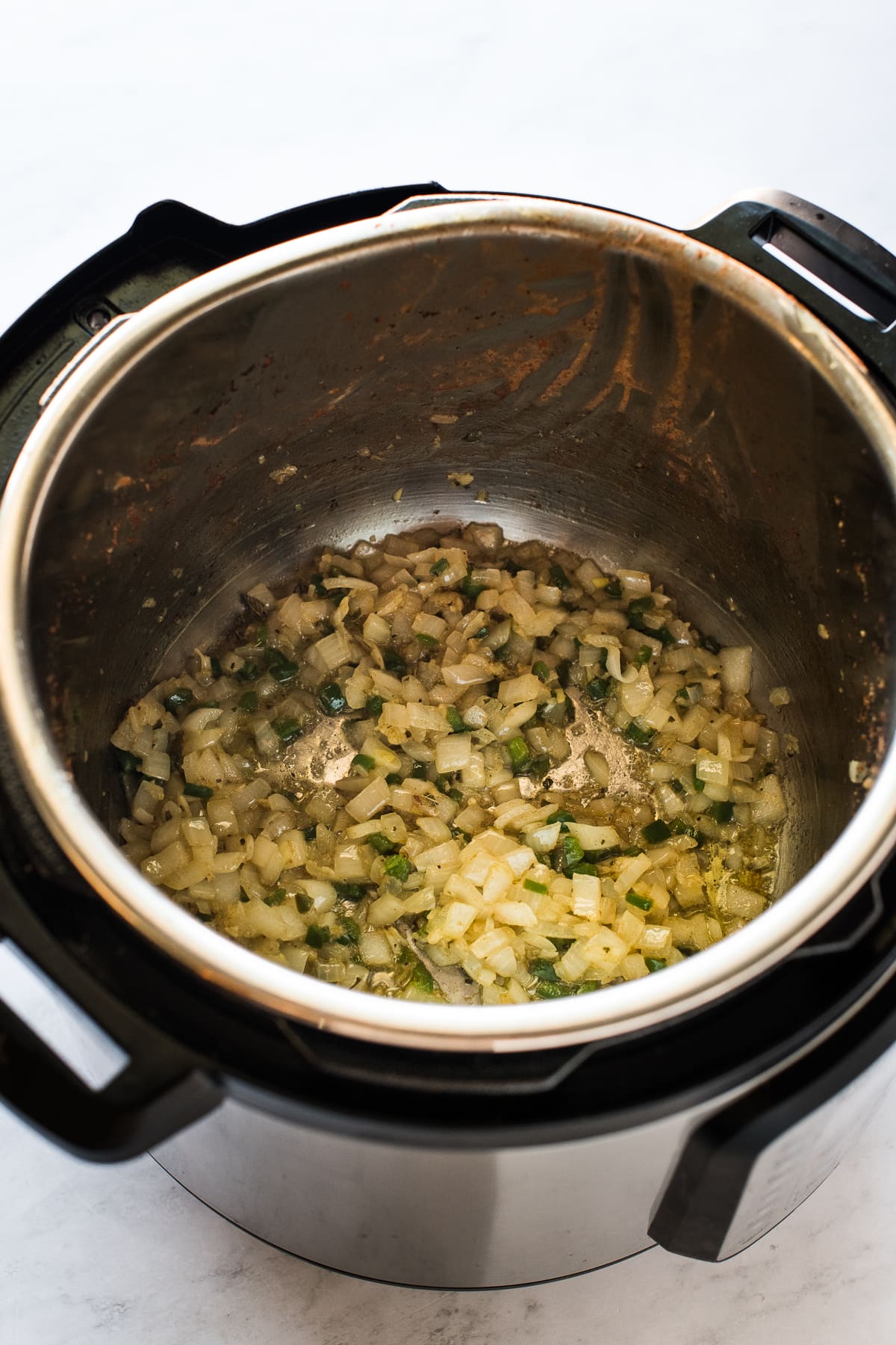 Sauteed onions, jalapenos, and garlic in an Instant Pot