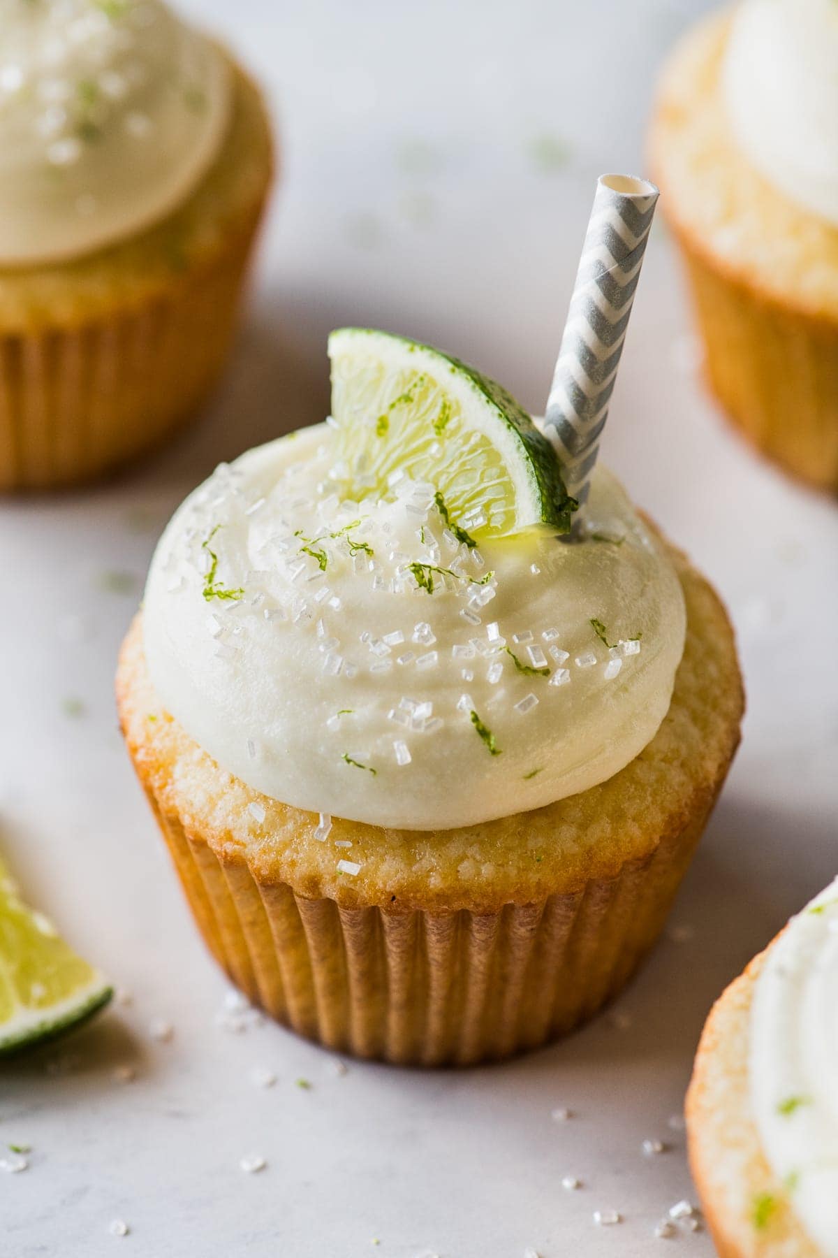 Margarita cupcakes topped with cream cheese frosting.