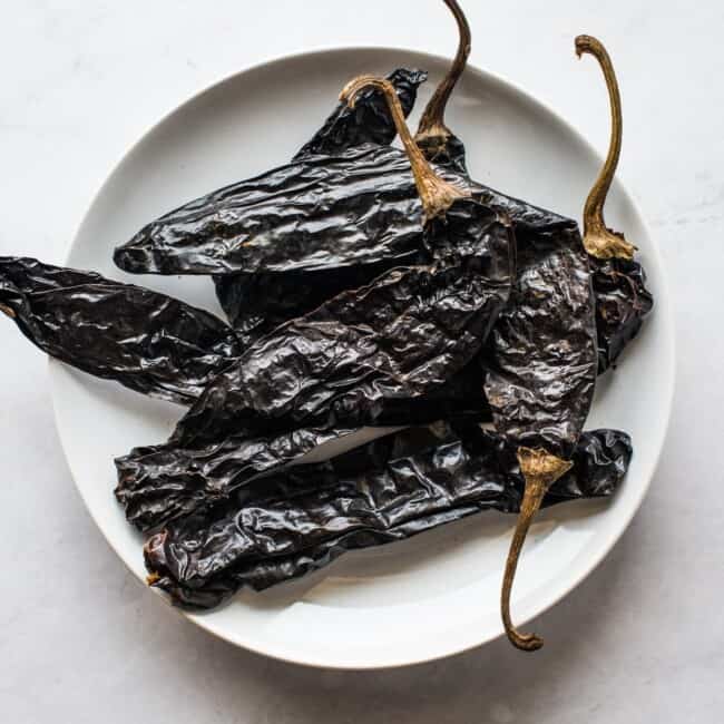 Pasilla peppers (chile pasilla) on a white plate