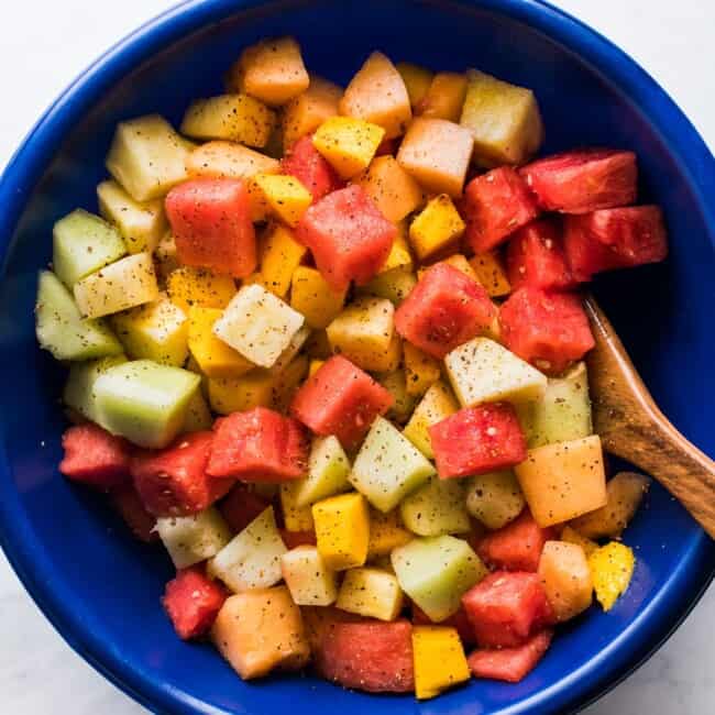 Mexican Fruit Salad topped with chili lime tajin seasoning.