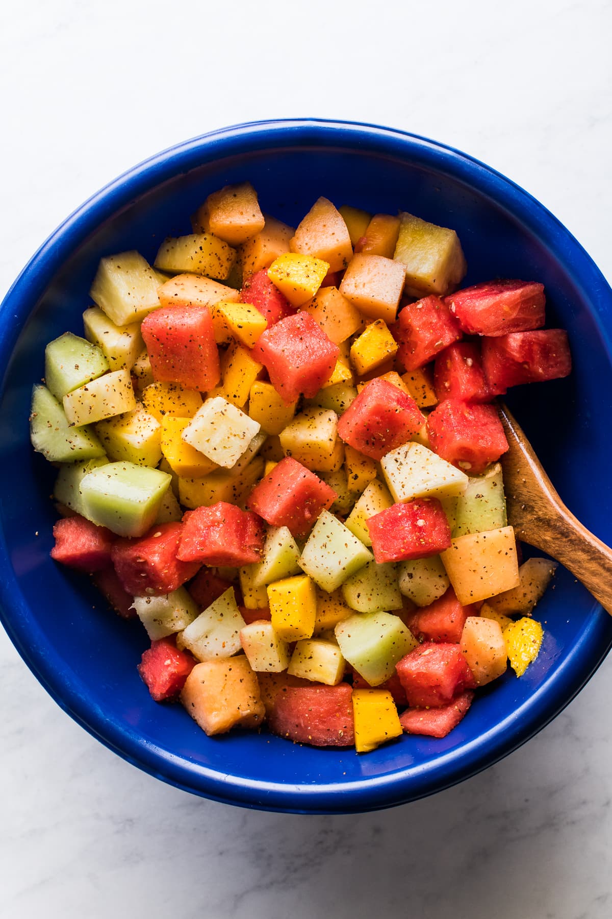 Mexican Fruit Salad topped with chili lime tajin seasoning.