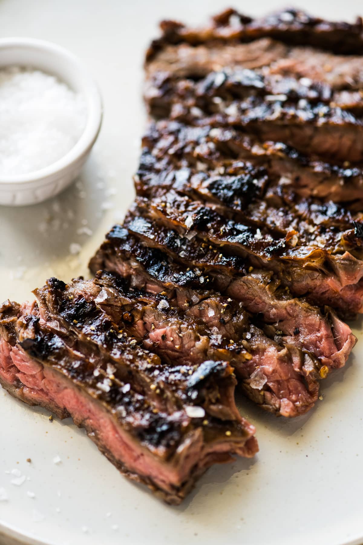 Thinly sliced marinated grilled skirt steak that was cut against the grain to further tenderize the meat.