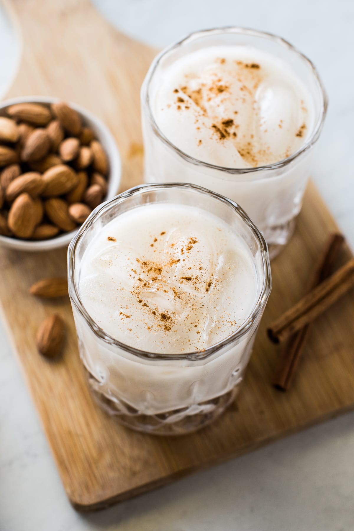 Two glasses of horchata on ice.