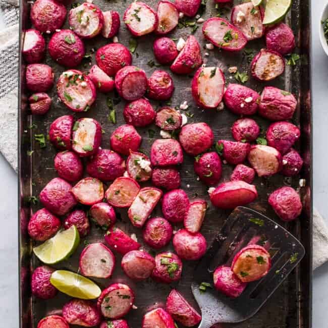 Roasted radishes on a sheet pan.