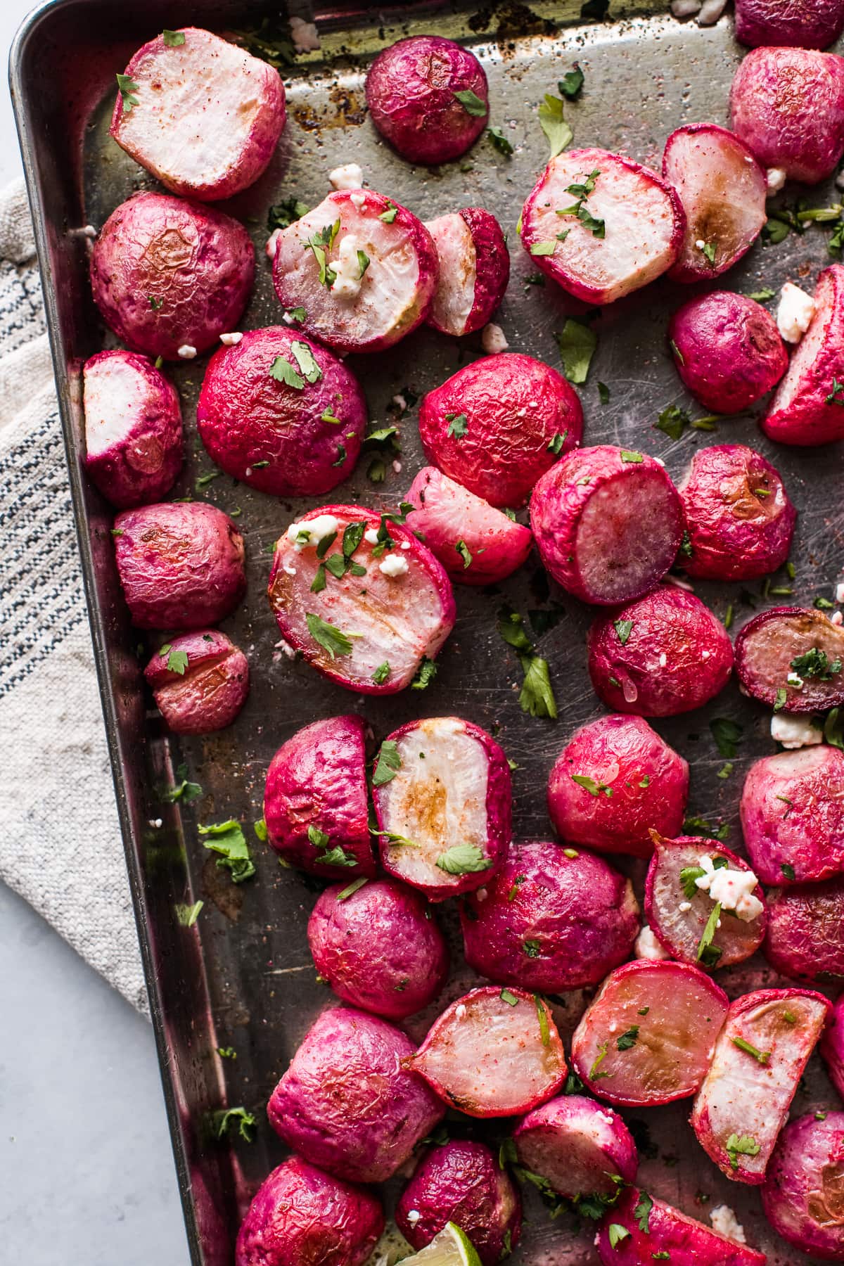 Roasted radishes topped with lime juice, cilantro, and cotija or feta cheese.