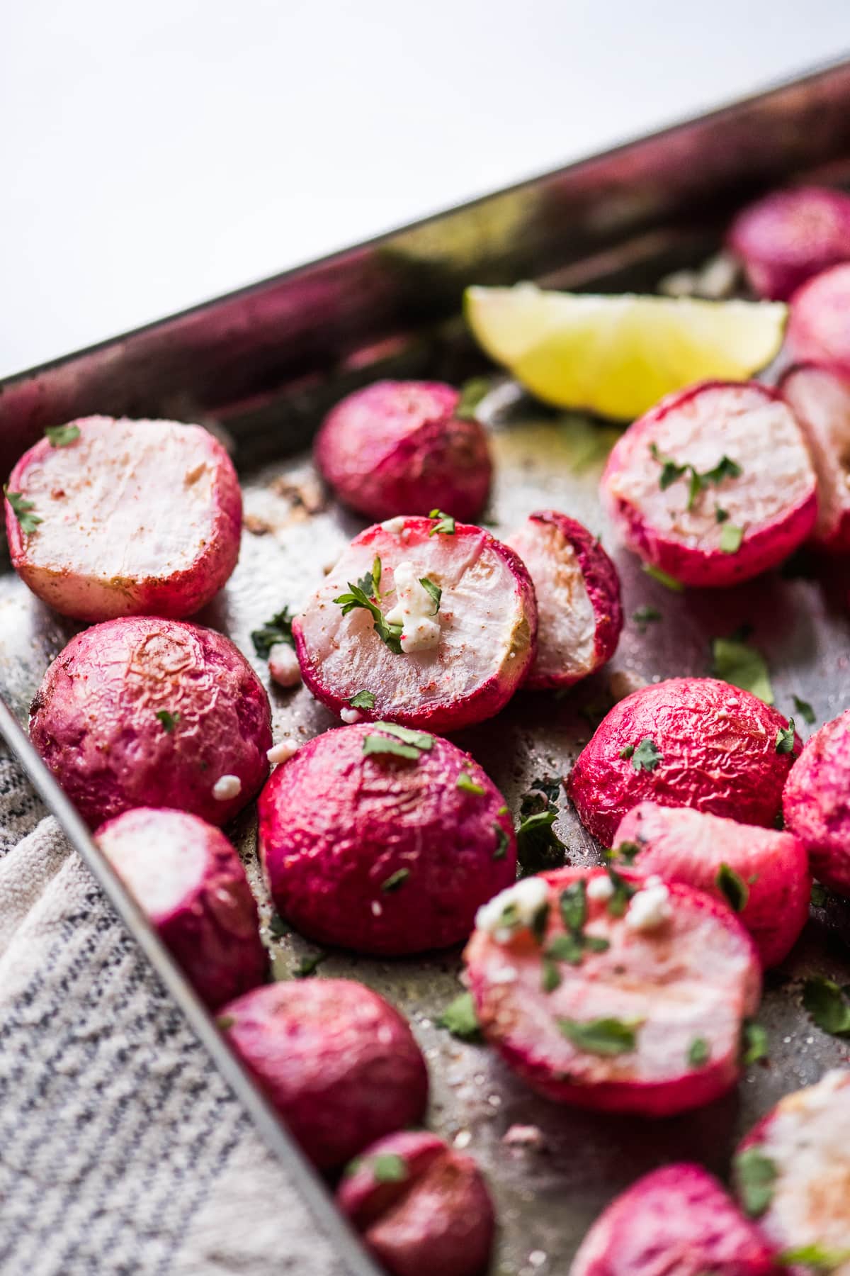 Simple roasted radishes topped with cilantro and cheese.