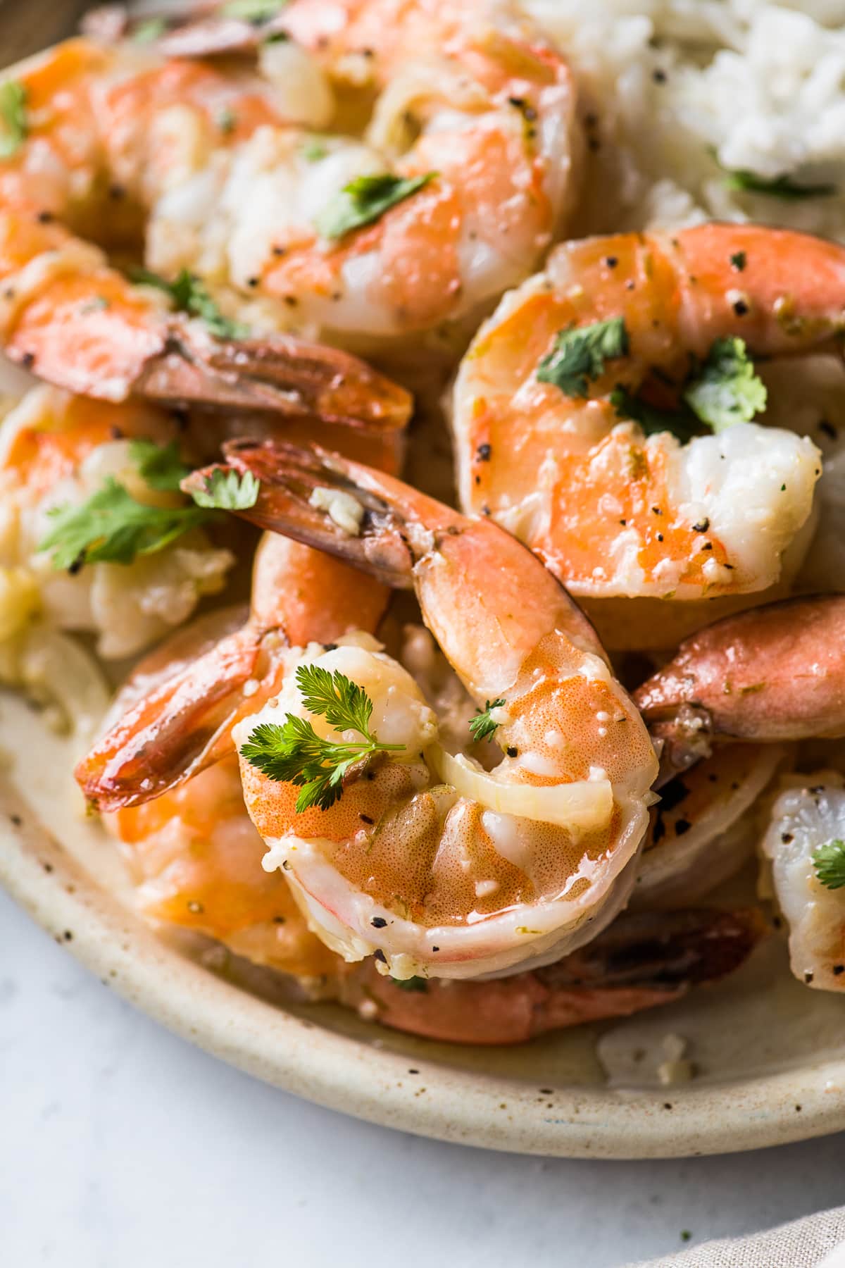 Camarones al Mojo de Ajo (Mexican Garlic Shrimp) on a plate topped with cilantro.