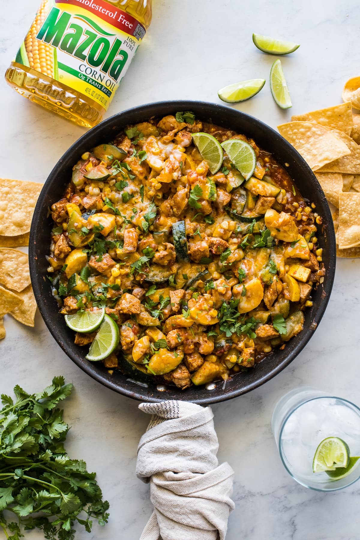 Mexican Chicken and Squash skillet garnished with cilantro and lime juice.