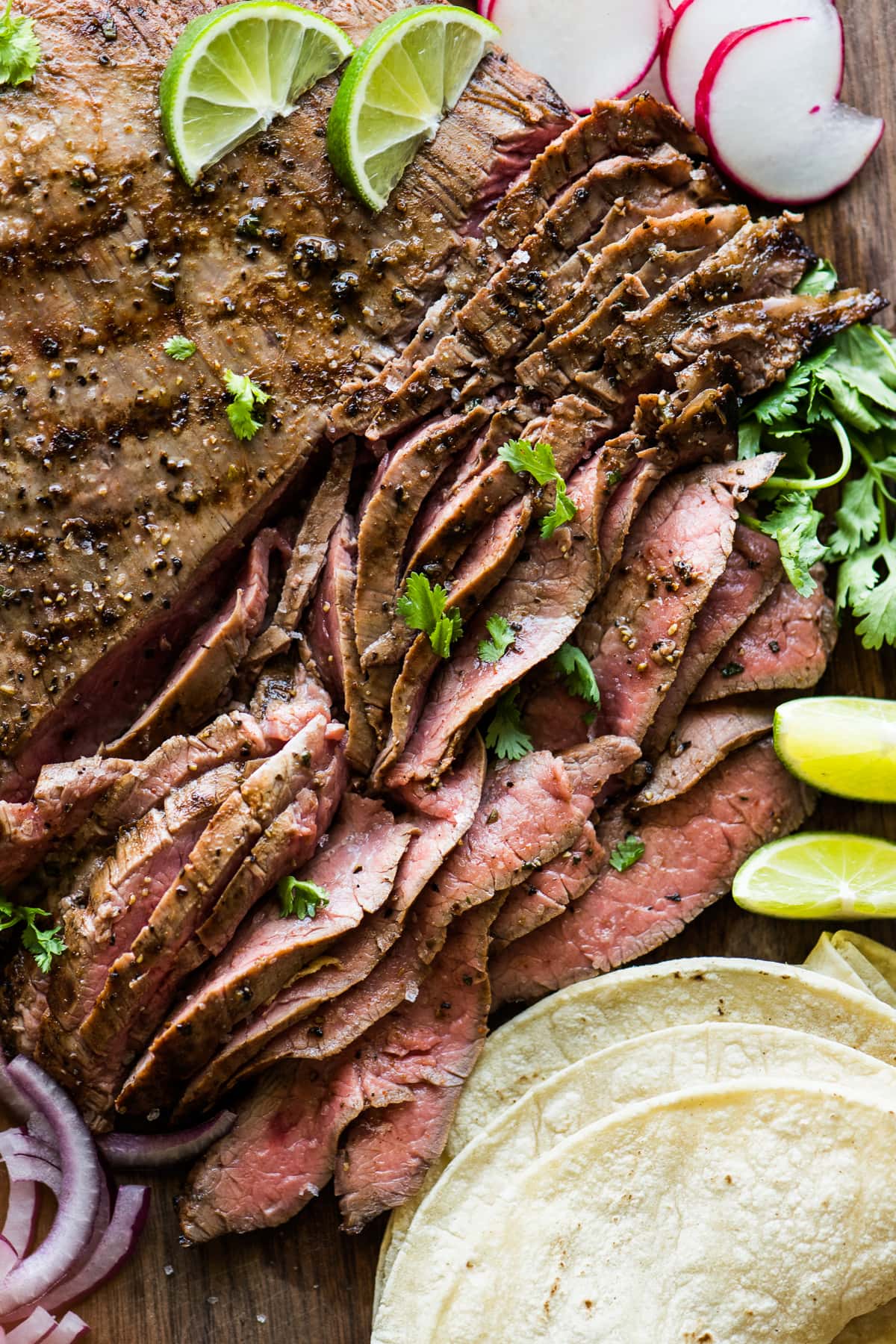 Grilled and thinly sliced carne asada ready to be served.