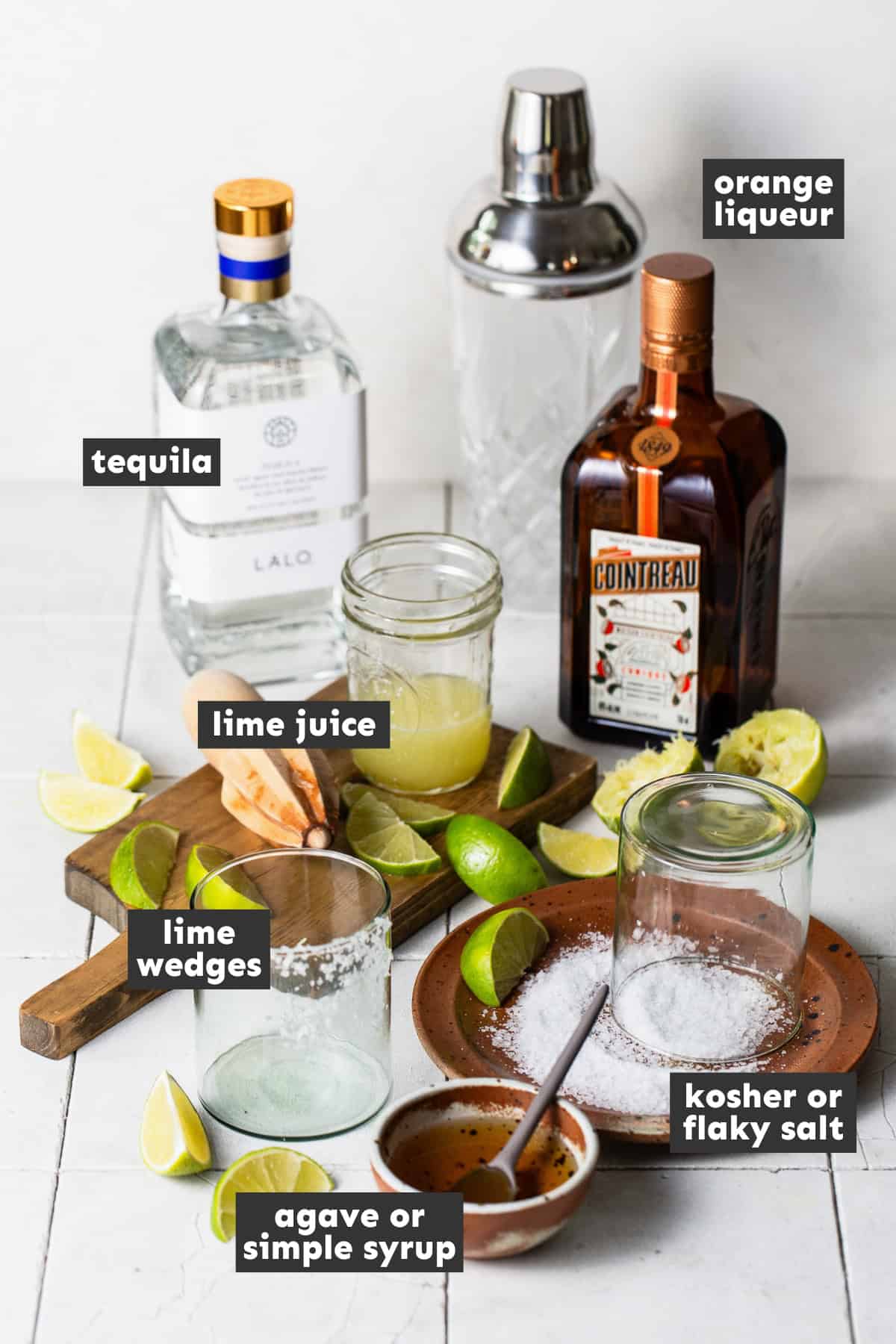Ingredients for a margarita recipe on a table ready to be used.