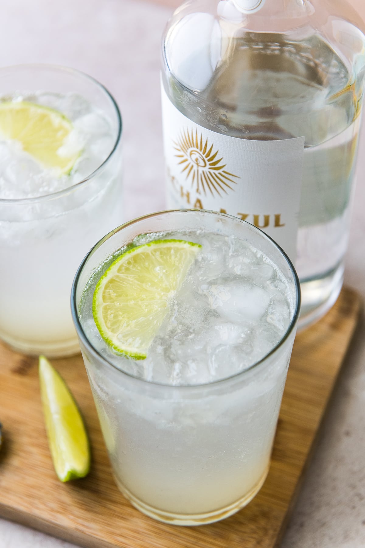 A refreshing anch water drink next to blanco tequila.