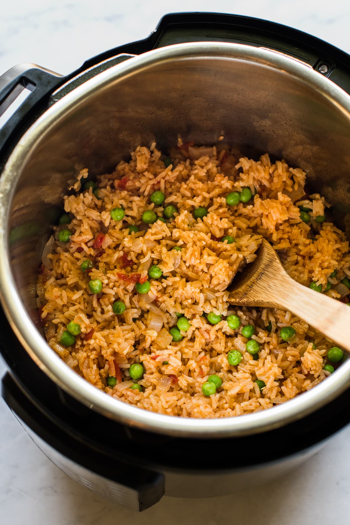 Instant Pot Mexican Rice with peas in the pressure cooker.