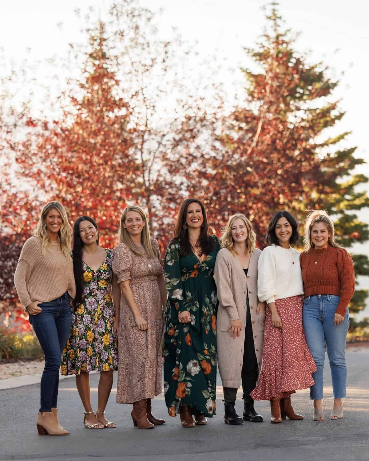 7 attendees of Fresh Air Retreat in Park City, Utah posing in front of a beautiful fall tree at Deer Valley Resort.