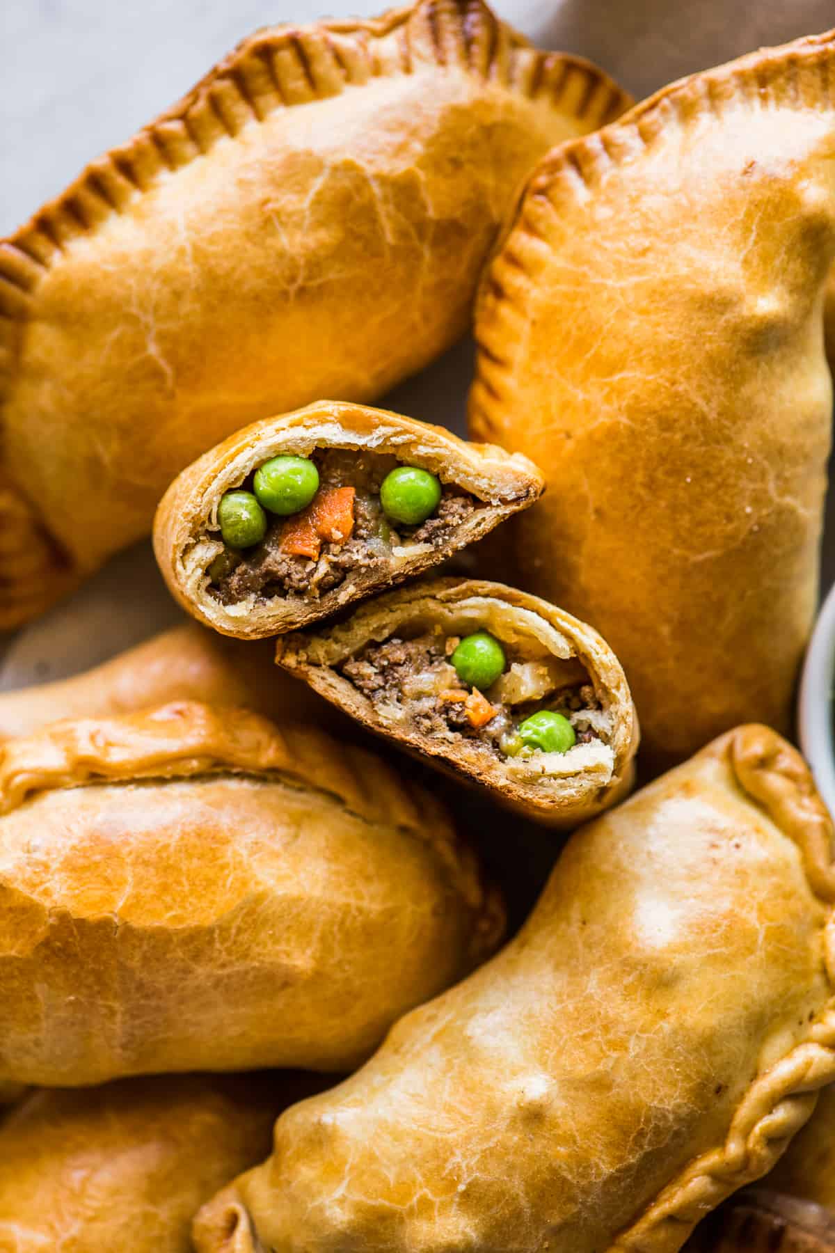 The insides of a beef empanada showing the ground beef picadillo mixture.