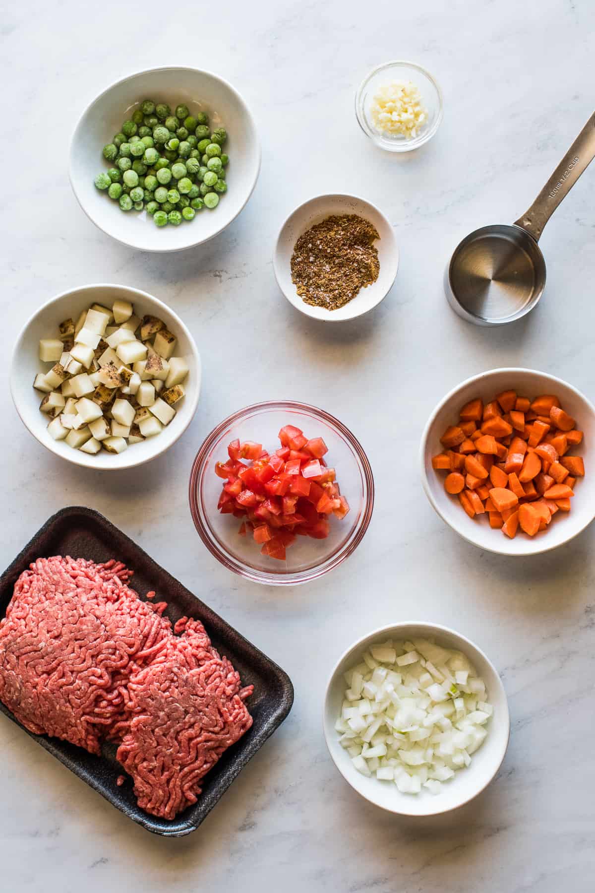 Ingredients for beef empanadas on a table.