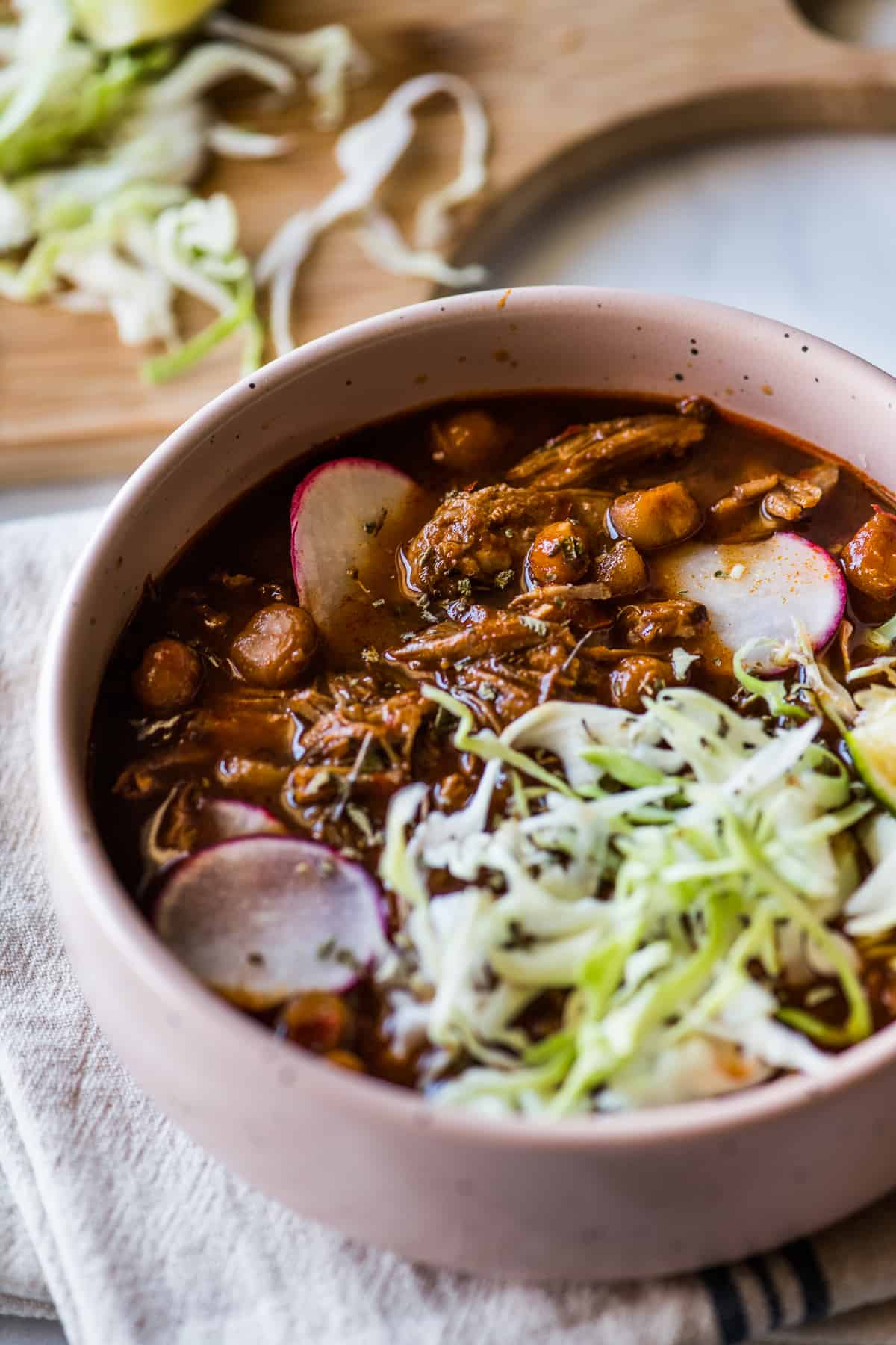 Instant Pot Pozole made with shredded pork and hominy in a red chile sauce.