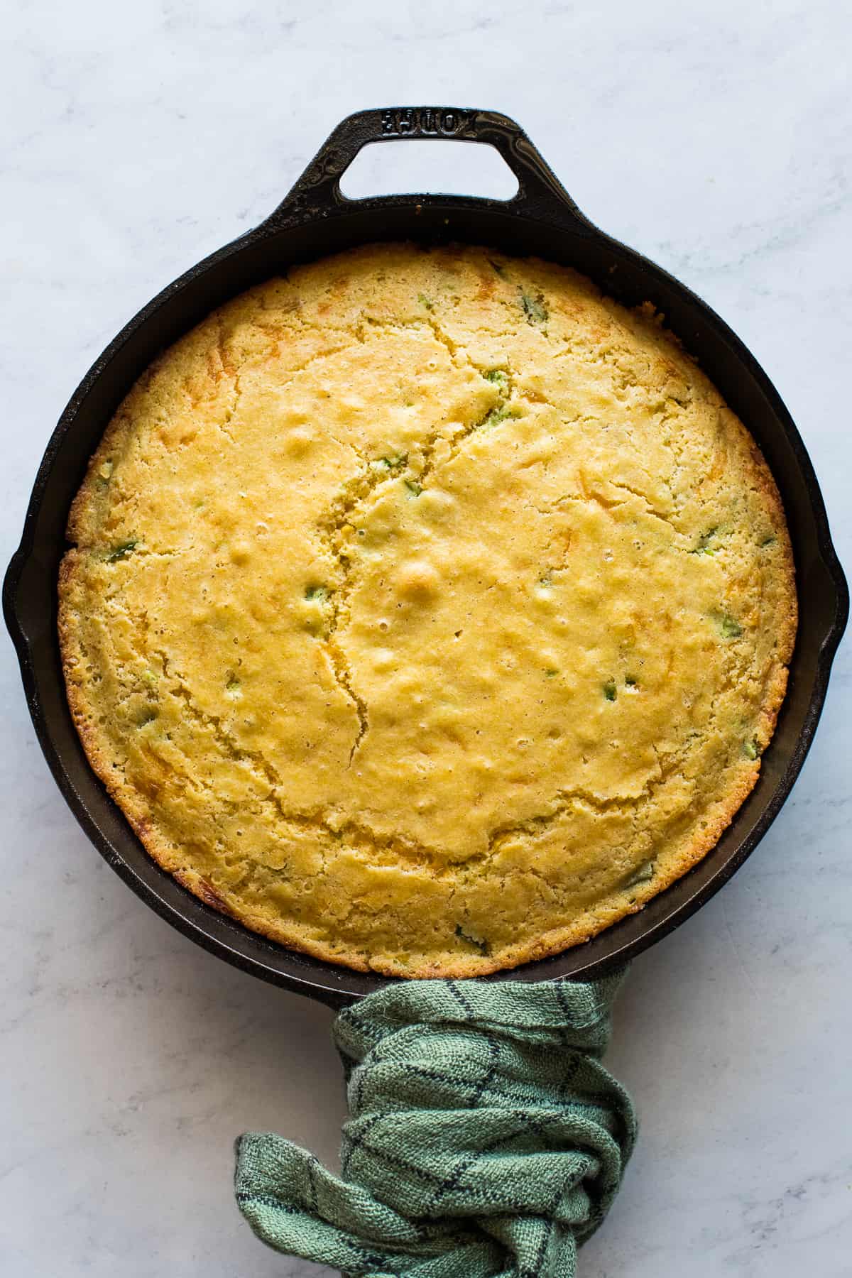 Easy Jalapeño Cornbread baked in a cast iron skillet ready to eat.