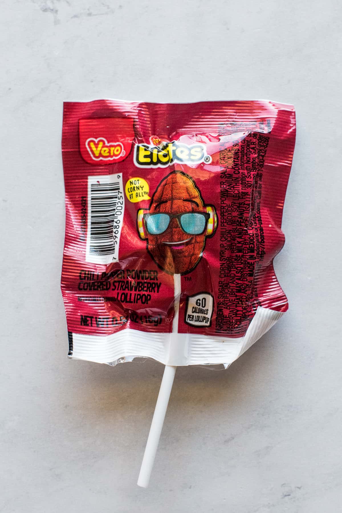 Vero Elotes chili powder covered strawberry lollipop