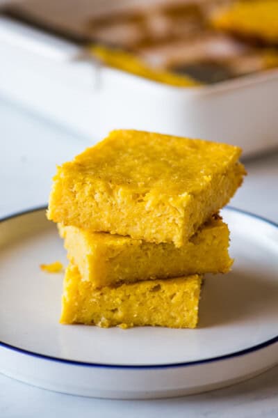 Pan de Elote stacked on top of one another on a plate.