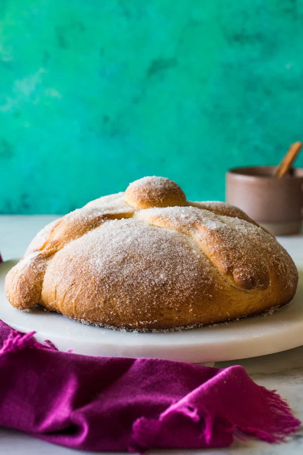Pan de Muerto (or Day of the Dead bread) covered in sugar and ready to eat.