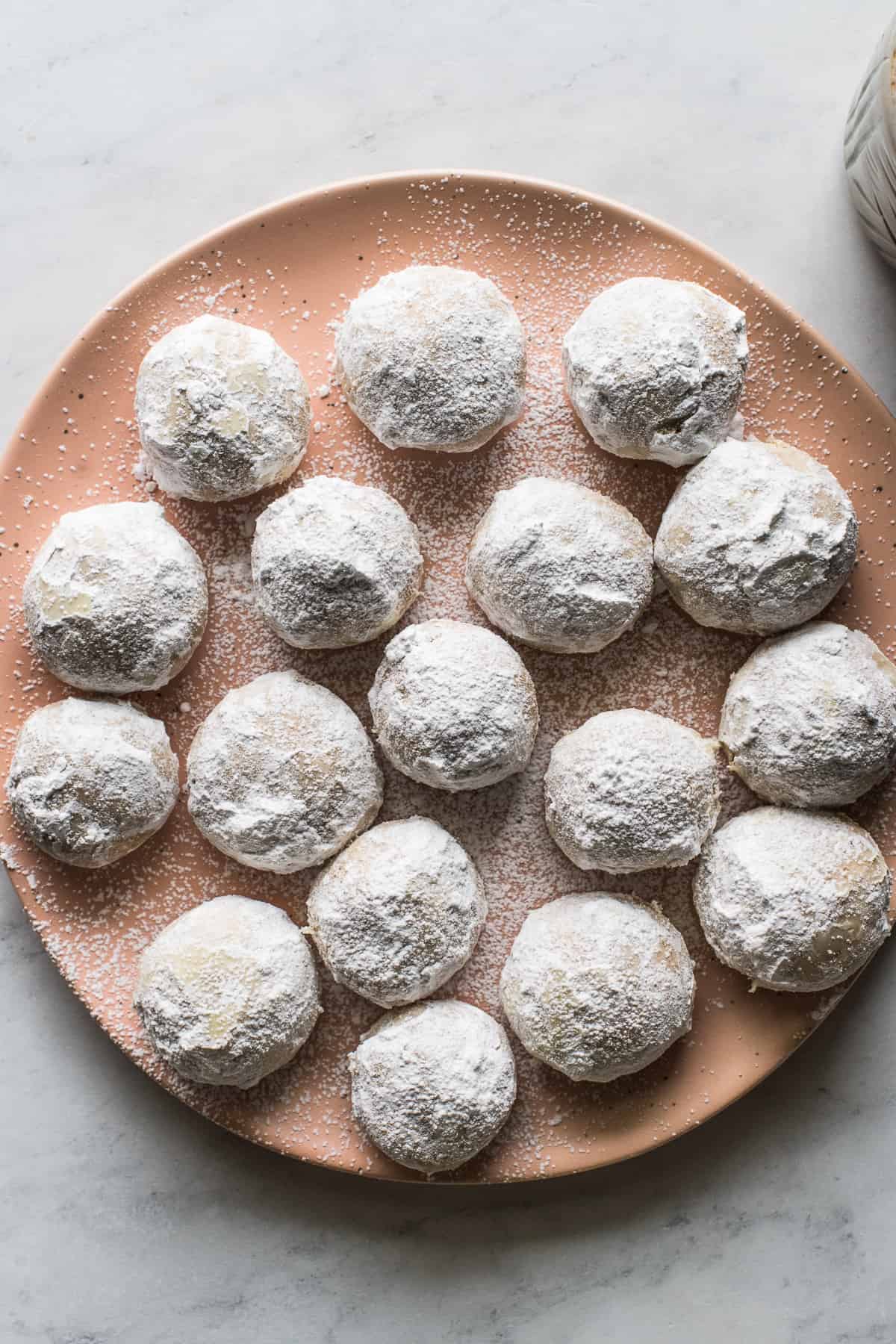 Mexican wedding cookies on a plate ready to eat.