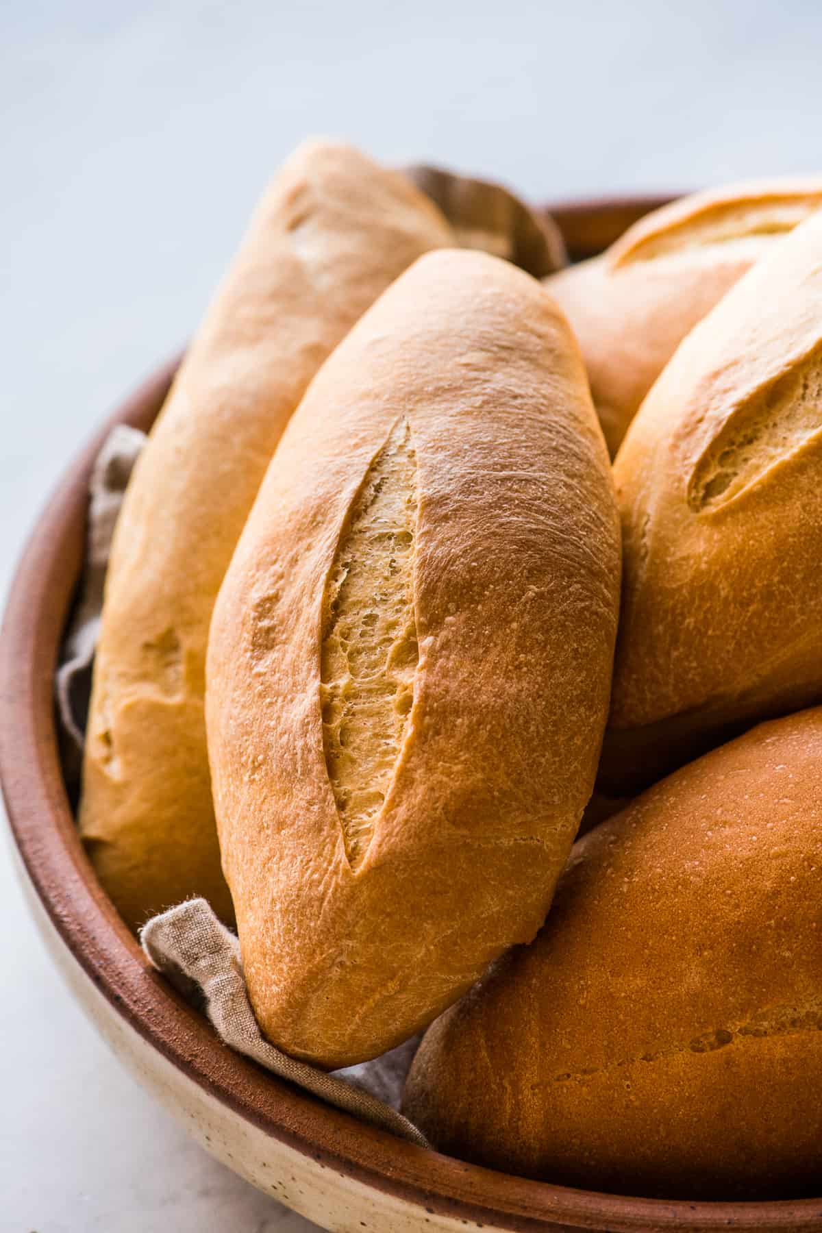 Mexican bolillo bread in a large serving bowl ready to eat.