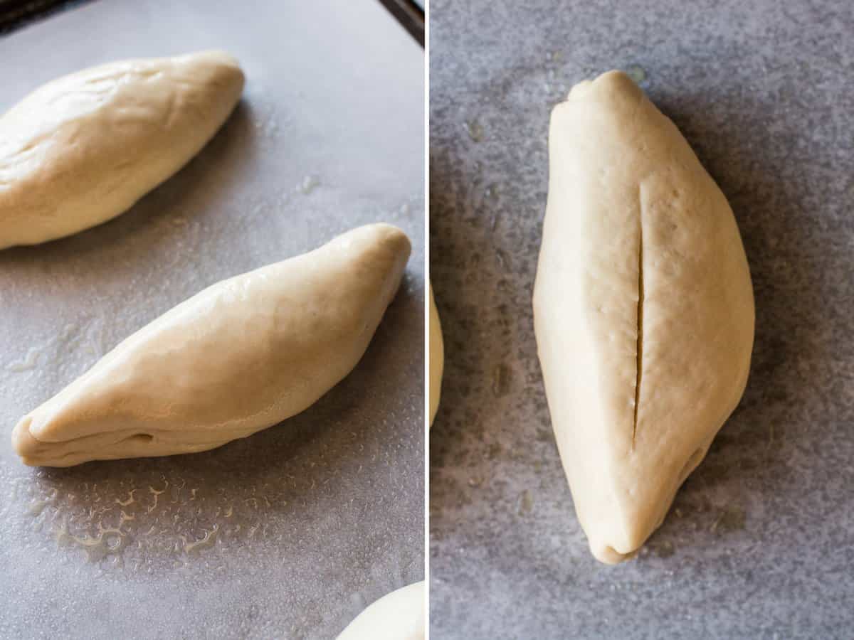 Shaped bolillo bread dough rising on a baking sheet and then a thin slit cut into the middle.