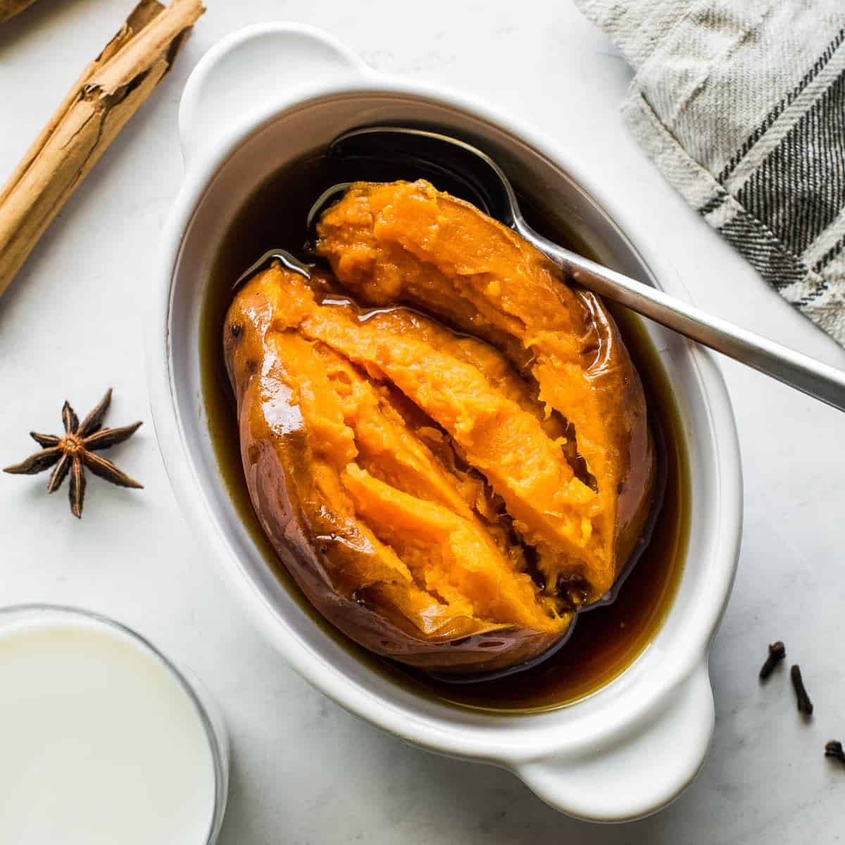 Camote Enmielado in a bowl with piloncillo syrup.