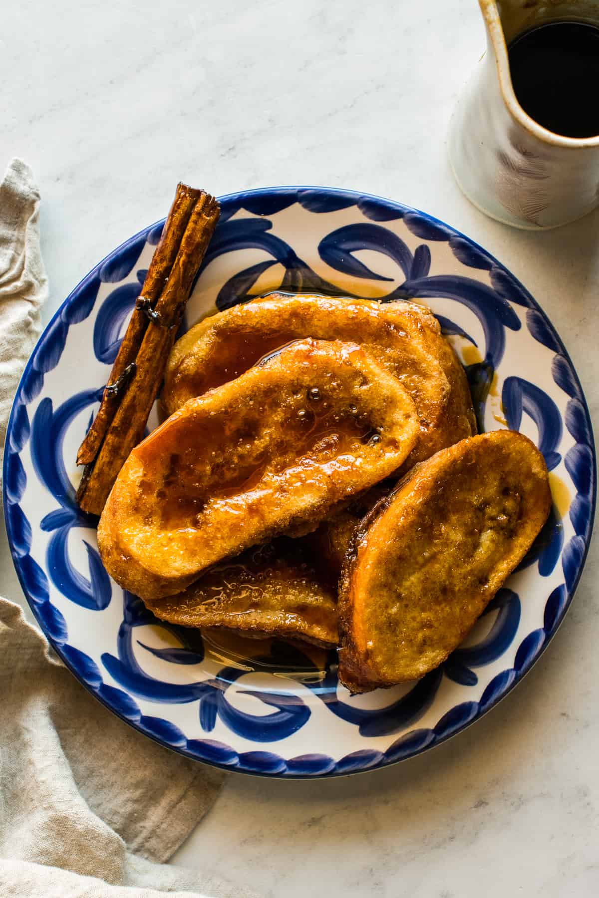 Torrejas ready to eat with piloncillo syrup poured on top.