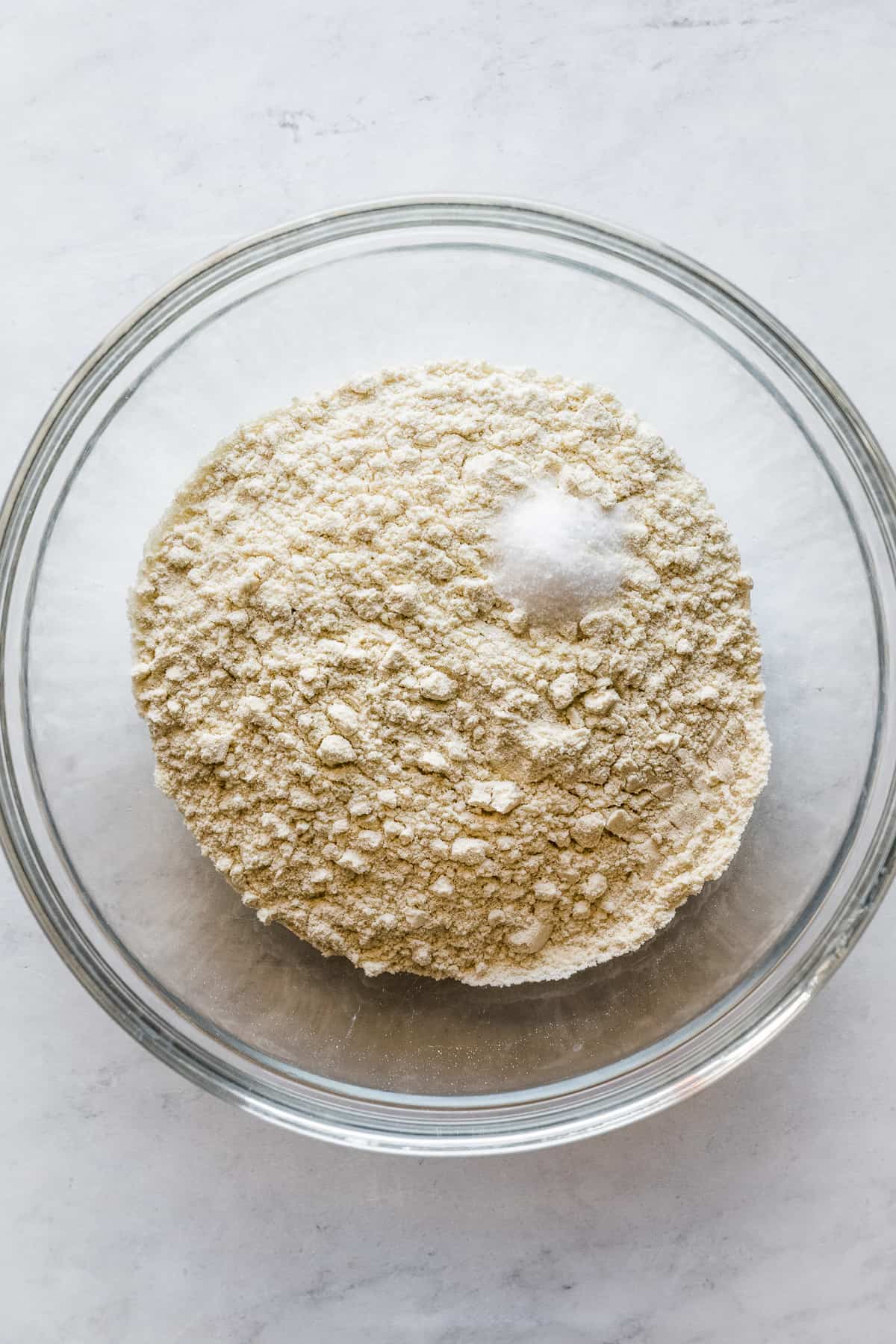 Masa harina and salt in a bowl.