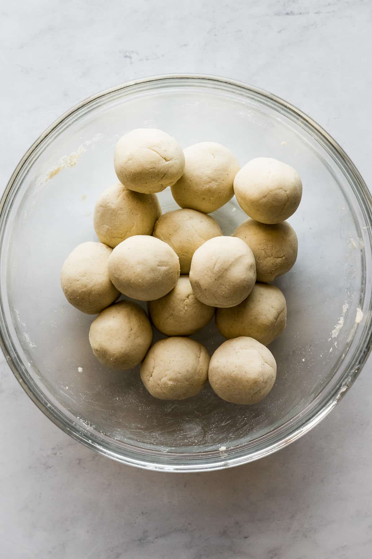 Balls of masa harina in a bowl.