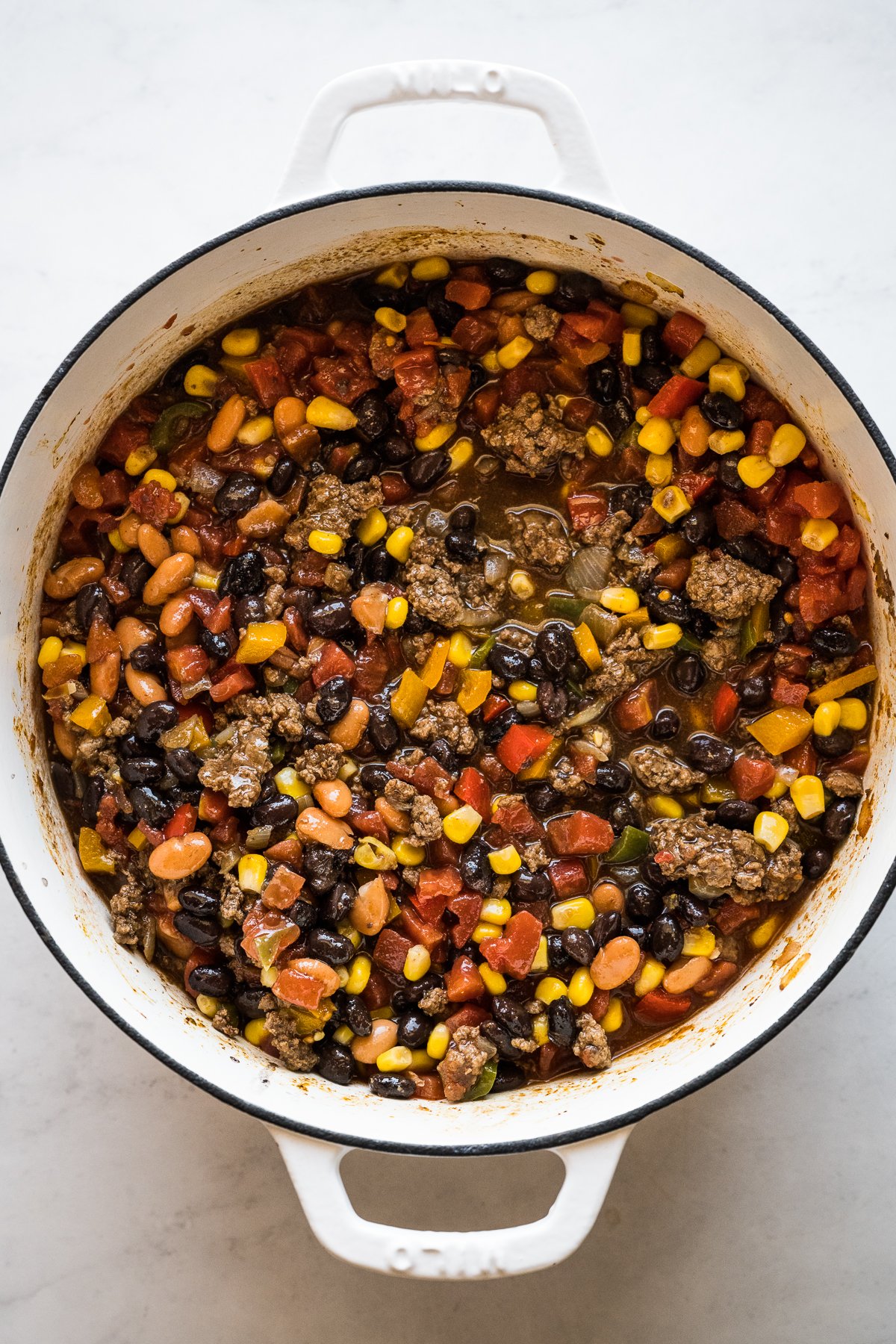 Taco soup mixed in a large pot.