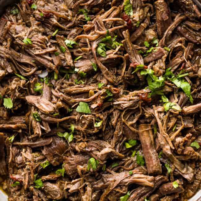 Shredded barbacoa beef in a serving bowl ready to eat.