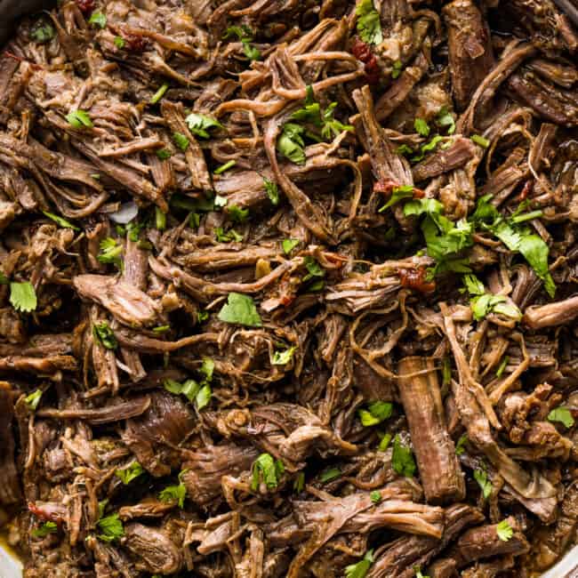 Shredded barbacoa beef in a serving bowl ready to eat.