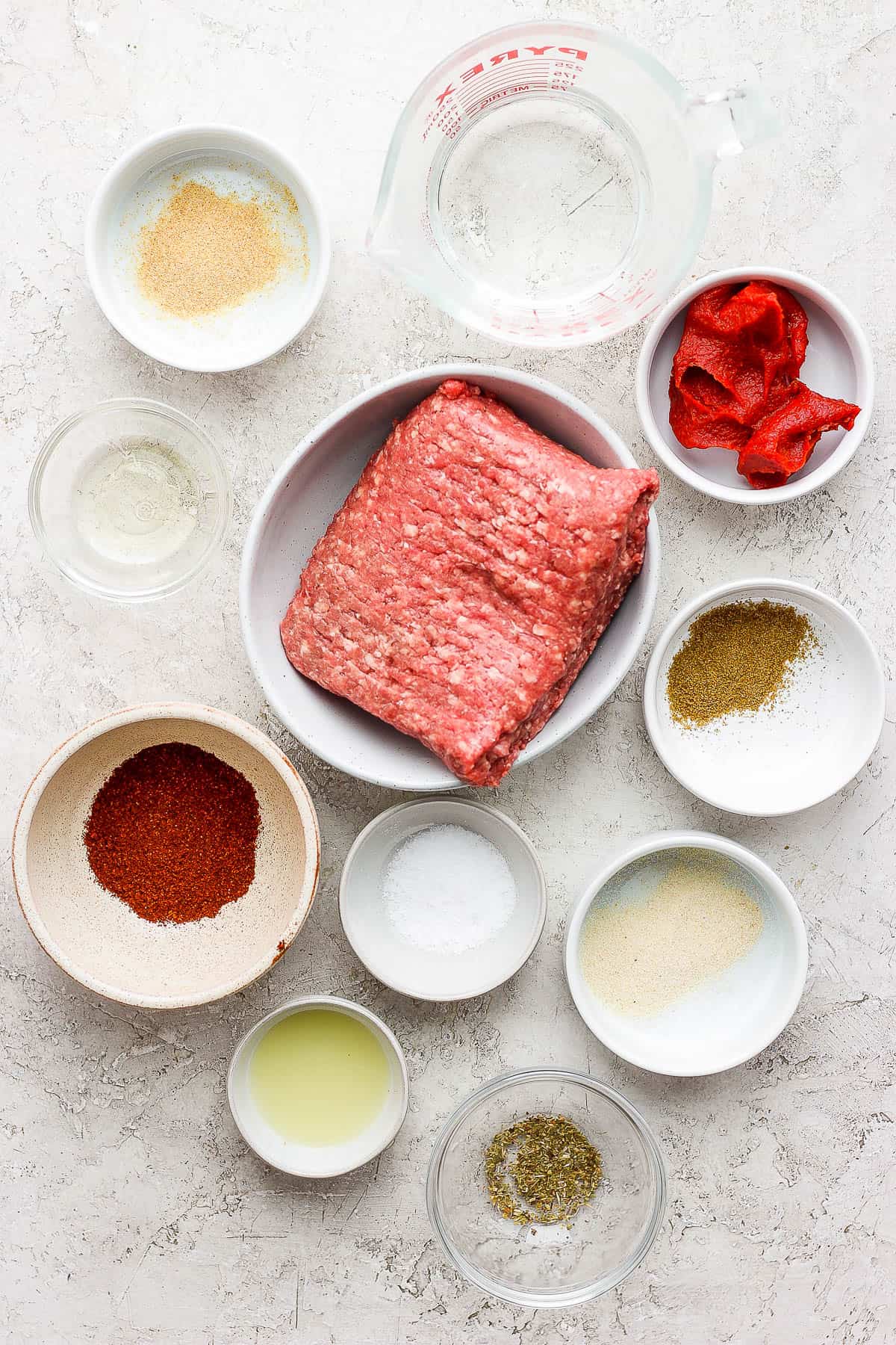 Ingredients for ground beef tacos on a table.