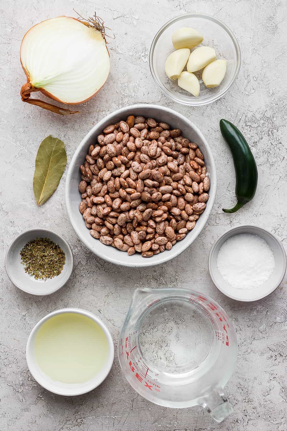 Ingredients for making refried beans on a table.