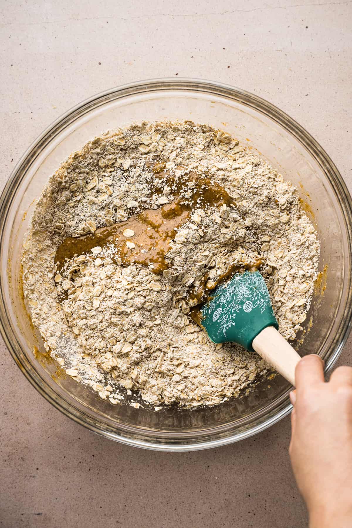 A mixing bowl showing the wet ingredients being combined with the dry ingredients.