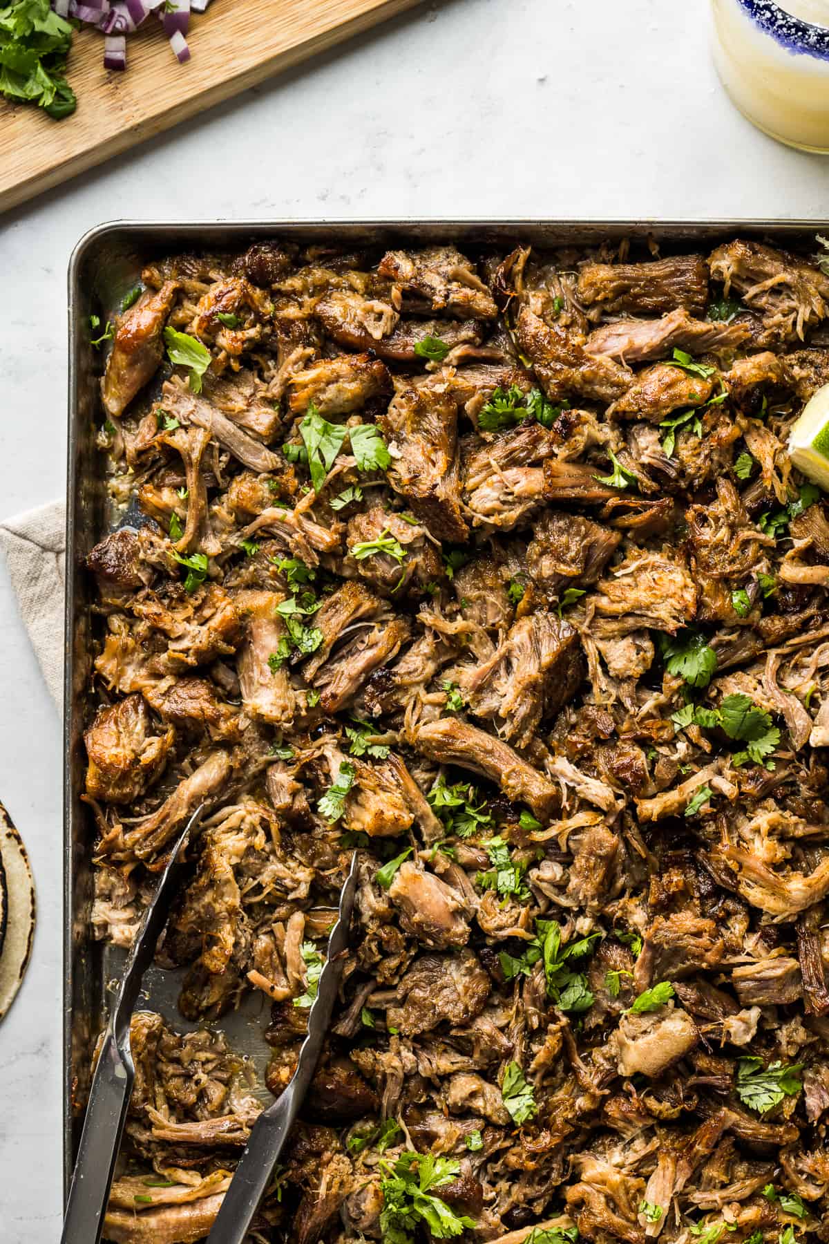 Carnitas on a sheet pan crisped up and ready to eat.