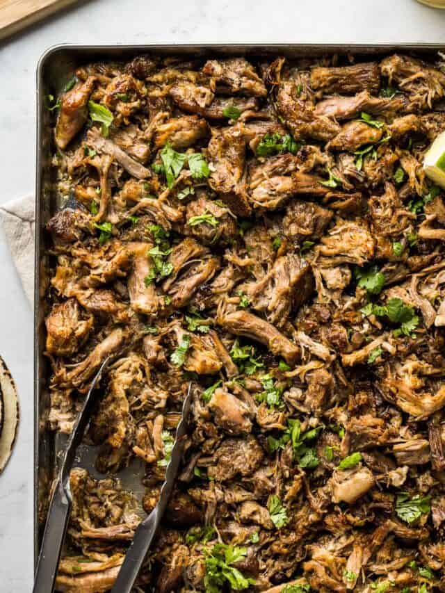 Carnitas on a sheet pan crisped up and ready to eat.