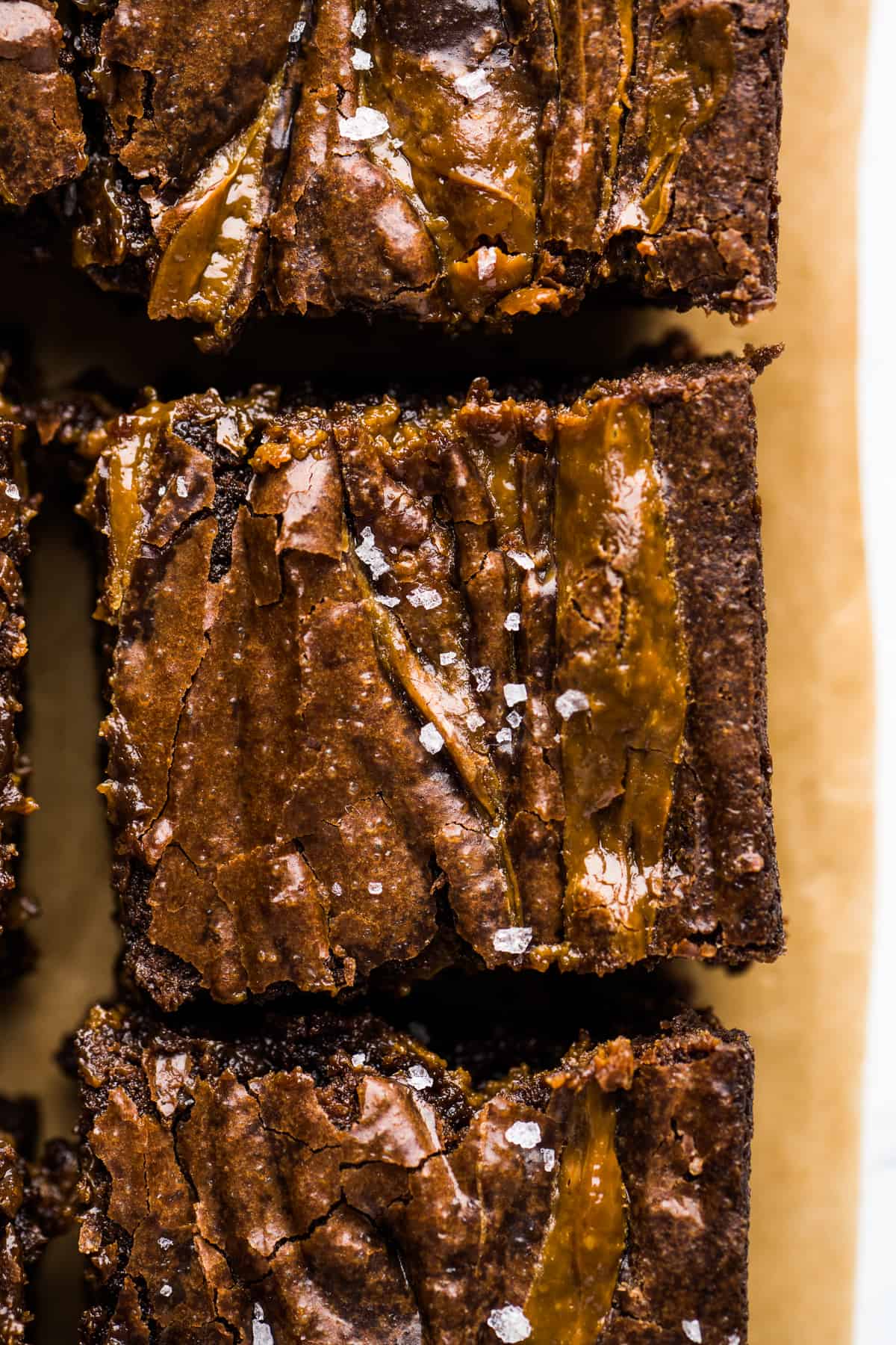 Dulce de Leche brownies cut into squares and garnished with flaky sea salt