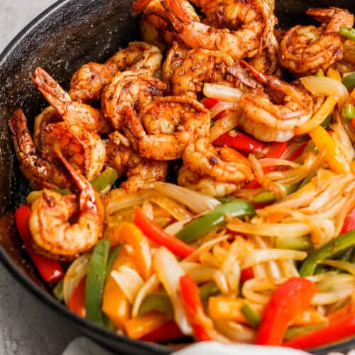 Shrimp Fajitas in a cast-iron skillet ready to be served.