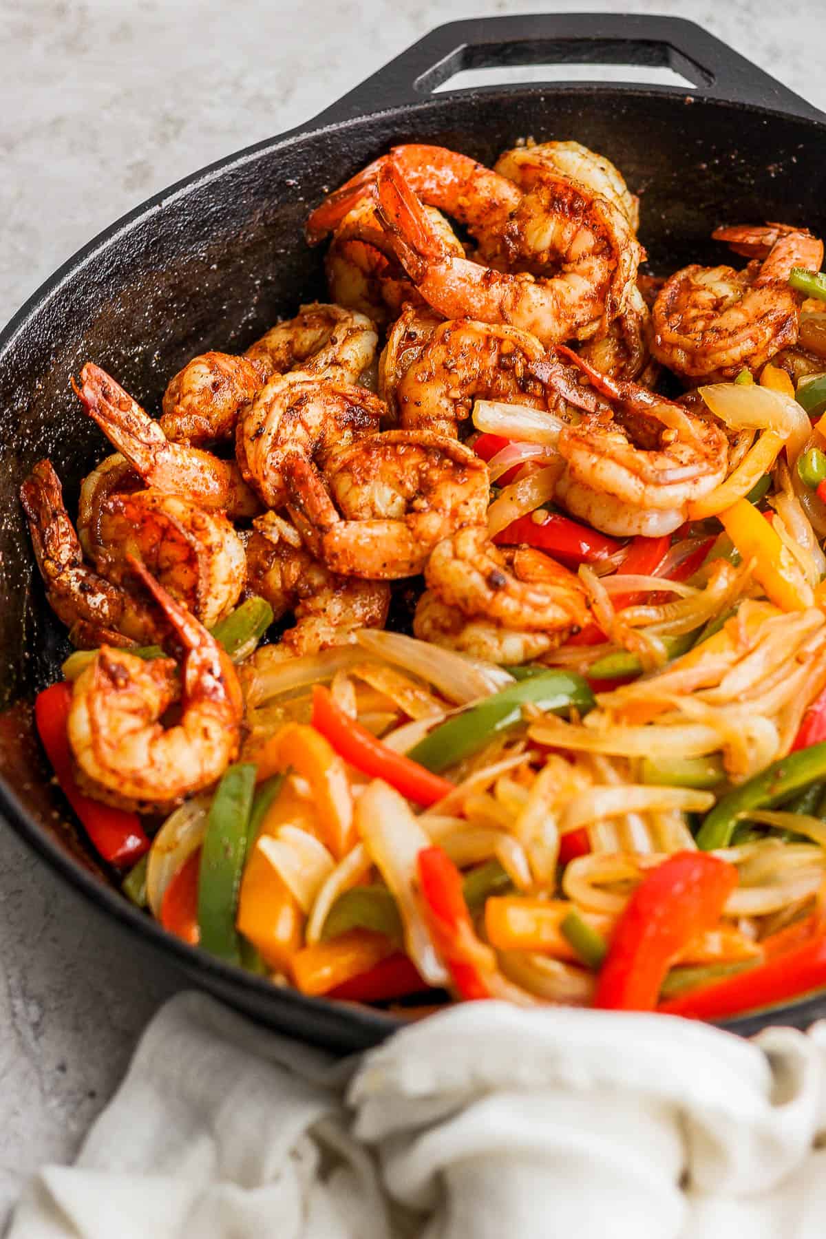Shrimp Fajitas in a cast-iron skillet ready to be served.