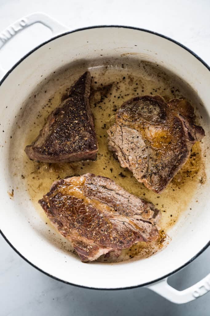 Beef searing in a pot for birria.