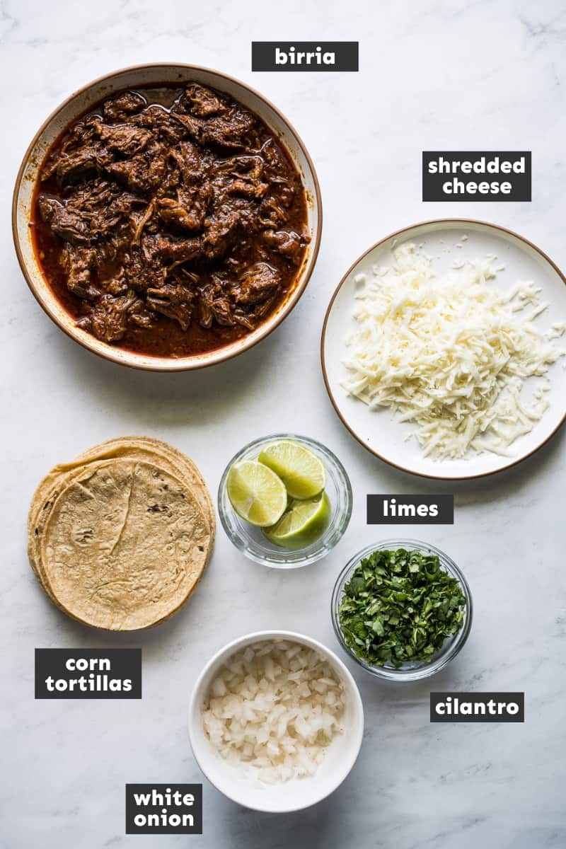 Birria tacos ingredients on a table.