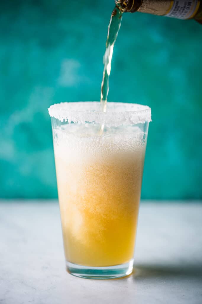 Beer being poured into a pint glass