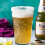 A Mexican chelada in a pint glass ready to drink.